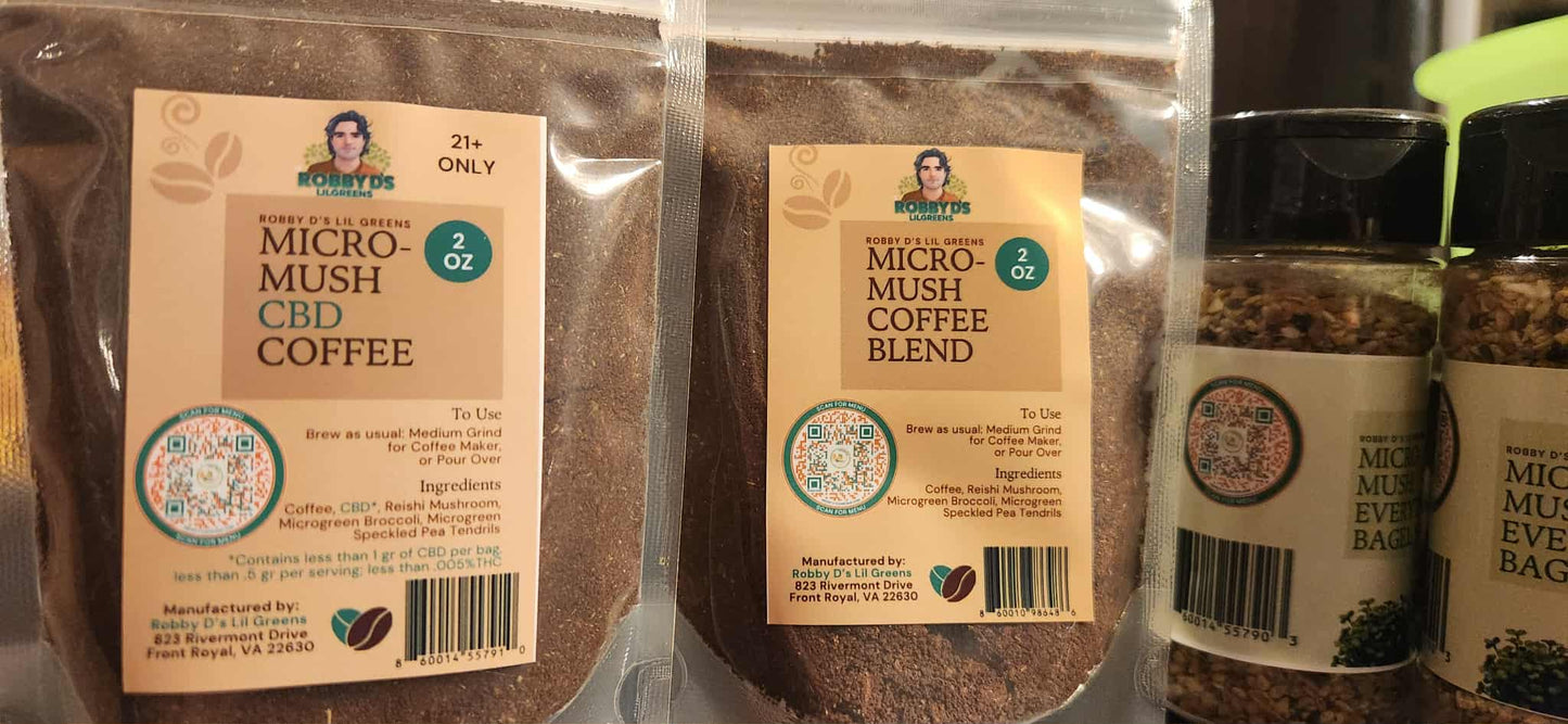 Two packages of Micro-Mush Coffee and a jar of the product on a metallic surface.